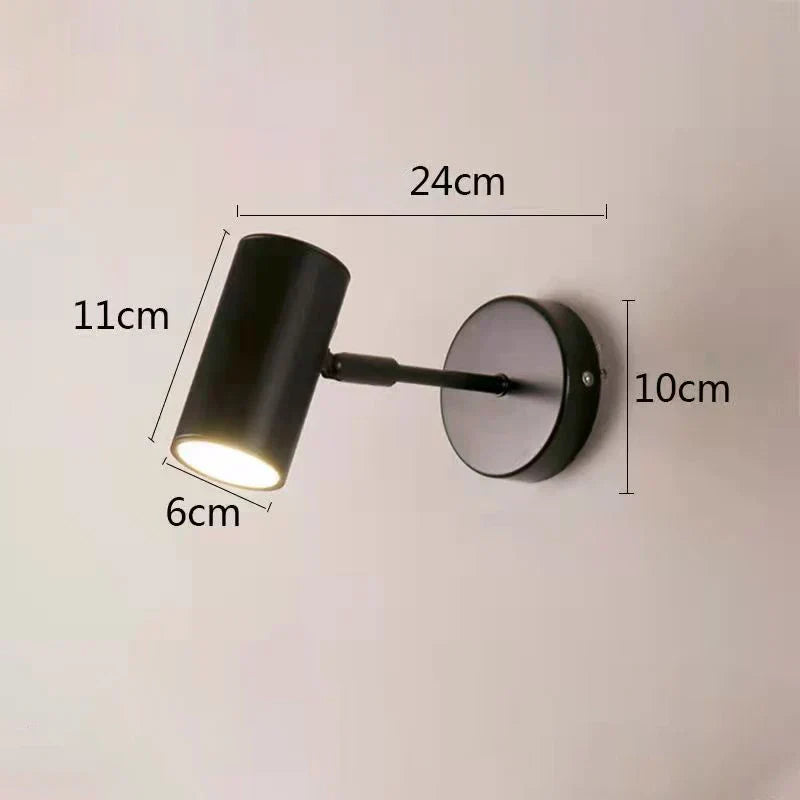 Justerbar vegglampe med hodet rettet nedover